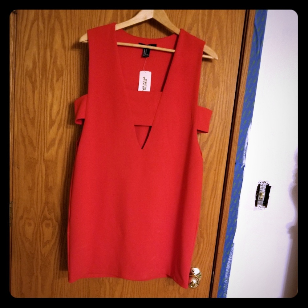 Never worn, Sexy  orange dress, open sides, lowcut